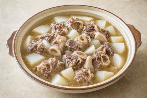 Photorealistic nourishing Chaoshan beef bone hot pot broth P10 food image by VDAMO